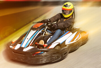 Woman driving sport car for karting  in a circuit lap outdoor in - obrazy, fototapety, plakaty