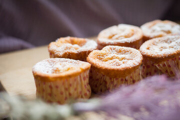 Sweet muffins with cottage cheese on wooden desk, homebaked muffins