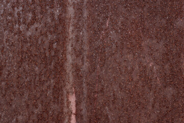 sheet of iron covered with reddish rust. Place for text