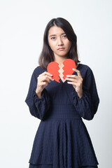 Beautiful young Asian woman with broken heart.