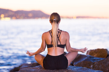 Young woman is meditating