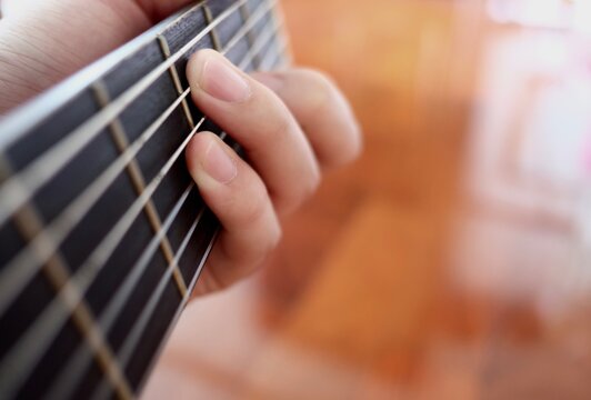 hand playing guitar