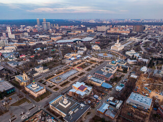 Fototapeta na wymiar Large city park VDNH in Moscow from above without people, in the frame idle fountains and empty streets. Aerial photography