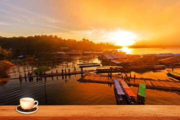 sunset on the lake with cup of coffee