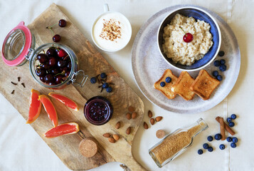 Healthy breakfast. Oat Flakes Porridge with toasts and fruits.
