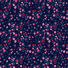 Vector seamless pattern. Pretty pattern in small flower. Small pink flowers. Dark blue background. Ditsy floral background. The elegant the template for fashion prints. © ann_and_pen