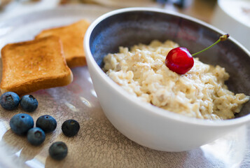 Healthy breakfast. Oat Flakes Porridge with toasts.