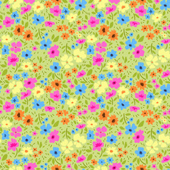 Vintage floral background. Seamless vector pattern for design and fashion prints. Flowers pattern with small colorful flowers on a light green background. Ditsy style.
