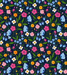 Fototapeta na wymiar Simple cute pattern in small multi colored flowers on dark blue background. Liberty style. Ditsy print. Floral seamless background. The elegant the template for fashion prints.