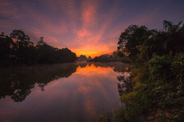 Natural background of a large reservoir in Krabi,Thailand(Nong Thale)atmosphere surrounded by mountains,trees of various sizes, blown through the wind,blurred cool during the day,a viewpoint of travel