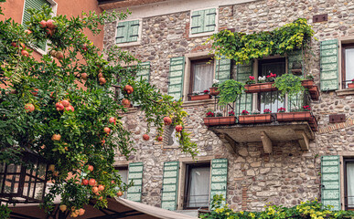 Fototapeta na wymiar Italian street old architecture in Lazise, town on Garda lake