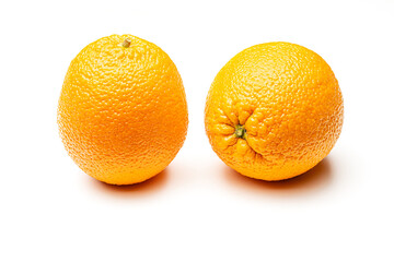 Two ripe oranges on a white background. Isolate Yellow orange.