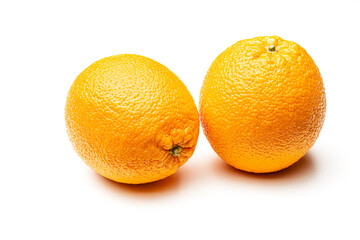 Two ripe oranges on a white background. Isolate Yellow orange.