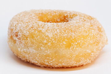 a donut with lots of sugar on white background