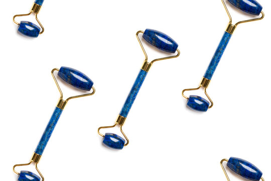 Pattern isolated on white. BLUE jade face lifting massage rollers arranged diagonally
