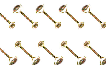 Pattern isolated on white. Multicolored jade face lifting massage rollers arranged diagonally