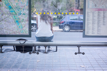 woman sitting at the bus stop