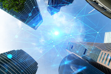 Abstract technology icons hologram on low, wide angle view of glass and steel contemporary...