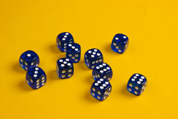 Many dice on yellow background