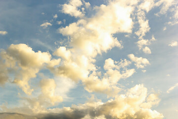 Beautiful sunset sky above clouds with dramatic light in twilight time. Beautiful sunset background