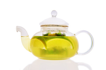 Transparent pot with lime, mint and ginger tea isolted on white