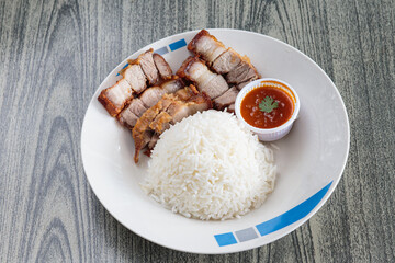 Three layers of crispy pork with rice.