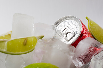 Fresh and cold drink.Pieces of lime and canned water.Summer refreshing beverage