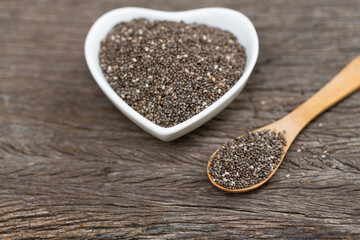 Healthy Chia seeds in a wooden spoon on the table close-up. horizontal