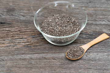 Healthy Chia seeds in a wooden spoon on the table close-up. horizontal