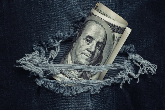 Hundred Dollar Bill In Torn Jeans Hole