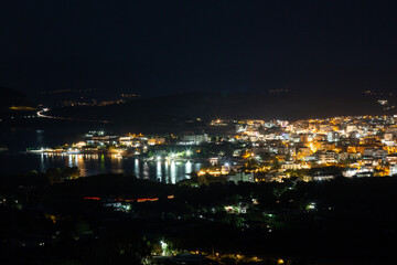 Fototapeta na wymiar Aerial view of night town from Hill after sunset - modern city with spectacular nightscape panorama. aerial view, night city with night sky. natural summer night. horizontal