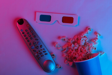 ovie time. Cardboard bucket of popcorn, tv remote and Stereoscopic anaglyph disposable paper 3d...
