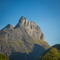 Romsdalshornet mountain, blue sky, summer time.
