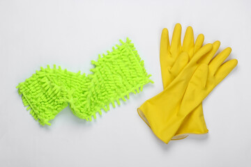 Rag for cleaning, gloves on a white background. Top view