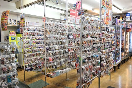 TOKYO, JAPAN - DECEMBER 1, 2016: People visit gaming toy figures collectible shop in Akihabara district of Tokyo, Japan. Akihabara Electric District specializes in anime and video games.