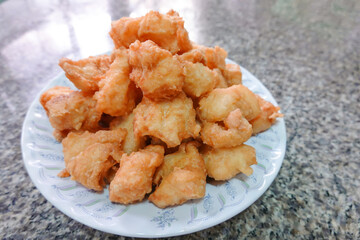 traditional Thai culture air fryer fried fish cuisine style or pra tod krob favorite famous street fast foods menu at thailand homemade with hot spicy sauces on table with sauce