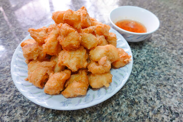 traditional Thai culture air fryer fried fish cuisine style or pra tod krob favorite famous street fast foods menu at thailand homemade with hot spicy sauces on table with sauce