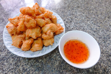 traditional Thai culture air fryer fried fish cuisine style or pra tod krob favorite famous street fast foods menu at thailand homemade with hot spicy sauces on table with sauce