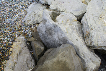 Large stones on the beach, seashore.