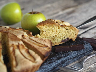 Homemade Apple pie on a rustic wooden background. A classic dessert made of dough for any holiday.
