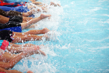 group of Kids kicking splashing water