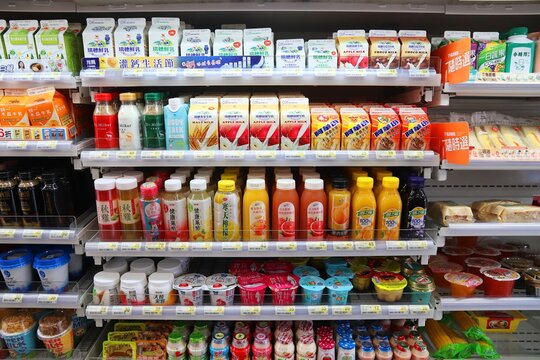 KEELUNG, TAIWAN - NOVEMBER 24, 2018: Milk Drinks, Yoghurts And Juices Selection At A Convenience Store Refrigerator In Keelung, Taiwan.