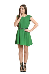 Beautiful woman posing in green dress on white background