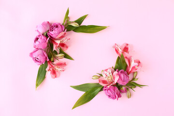 Fototapeta na wymiar Rose buds frame on pink background.