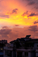 Evening city sky sunset burning clouds