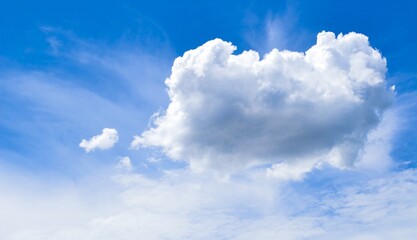 Naklejka na ściany i meble Beautiful big cloud float on the blue sky.