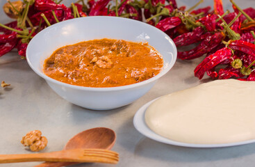 Georgian traditional food Elarji or cornflour with cheese and soup Kharcho or walnuts souse with...