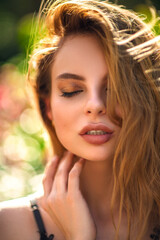 Fototapeta premium closeup portrait of a young woman with roses