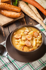 Traditional Polish split pea soup with sausage, bacon and potato