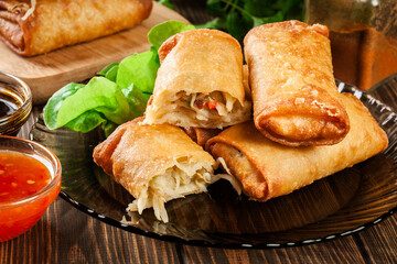 Spring rolls with chicken and vegetables served with sweet chili sauce or soy sauce